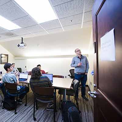 Undergraduates in Emory's Institute for Quantitative Theory and Methods meet to work on their capstone projects.