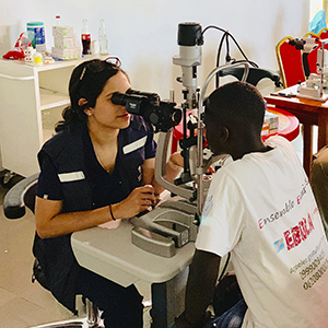 ophthalmologist running an eye exam on a patient