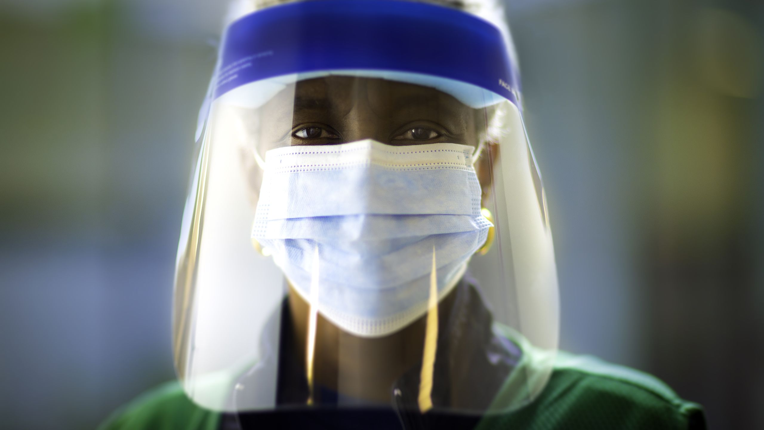 Determined looking nurse in protective gear